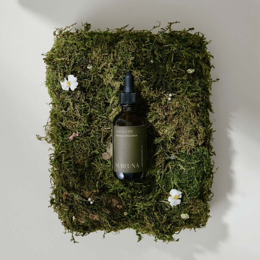 Photo of Subluna Adrenal RX adrenal restoration blend bottle on moss background, stocked by Born Primal in Australia