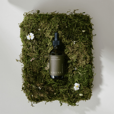 Photo of Subluna Adrenal RX adrenal restoration blend bottle on moss background, stocked by Born Primal in Australia